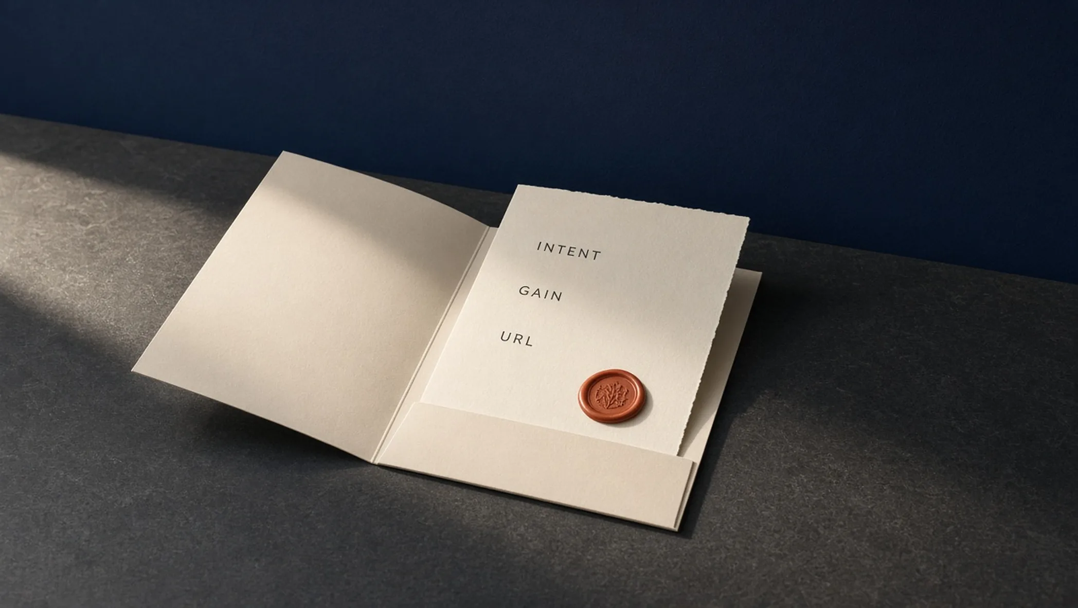 Cream briefing folder with a terracotta seal on a charcoal desk, labeled Intent, Gain, and URL